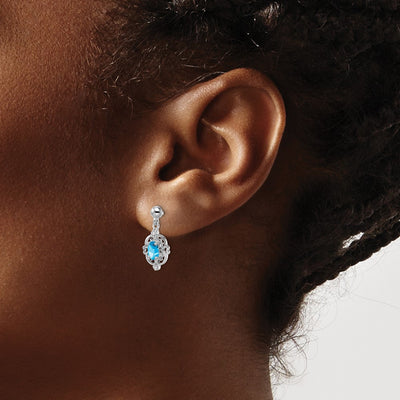 Sterling Silver Rhodium Plated Blue Topaz and Diamond Post Earrings, 17 x 7mm