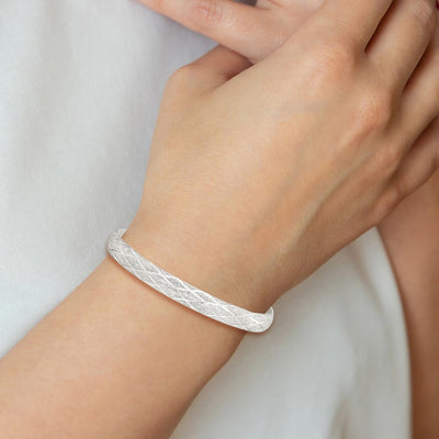 Sterling Silver Laser-cut X-Design Oval Flexible Bangle