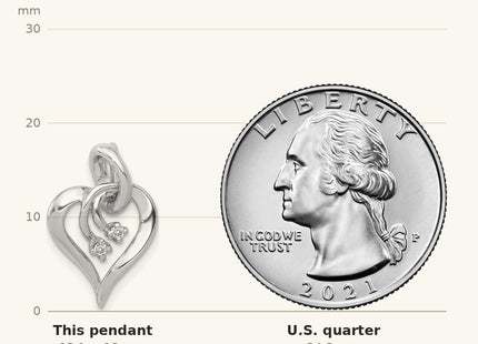 True size: 14k White Gold AA Diamond Fancy Heart Pendant shown next to a US quarter (24.3 mm)